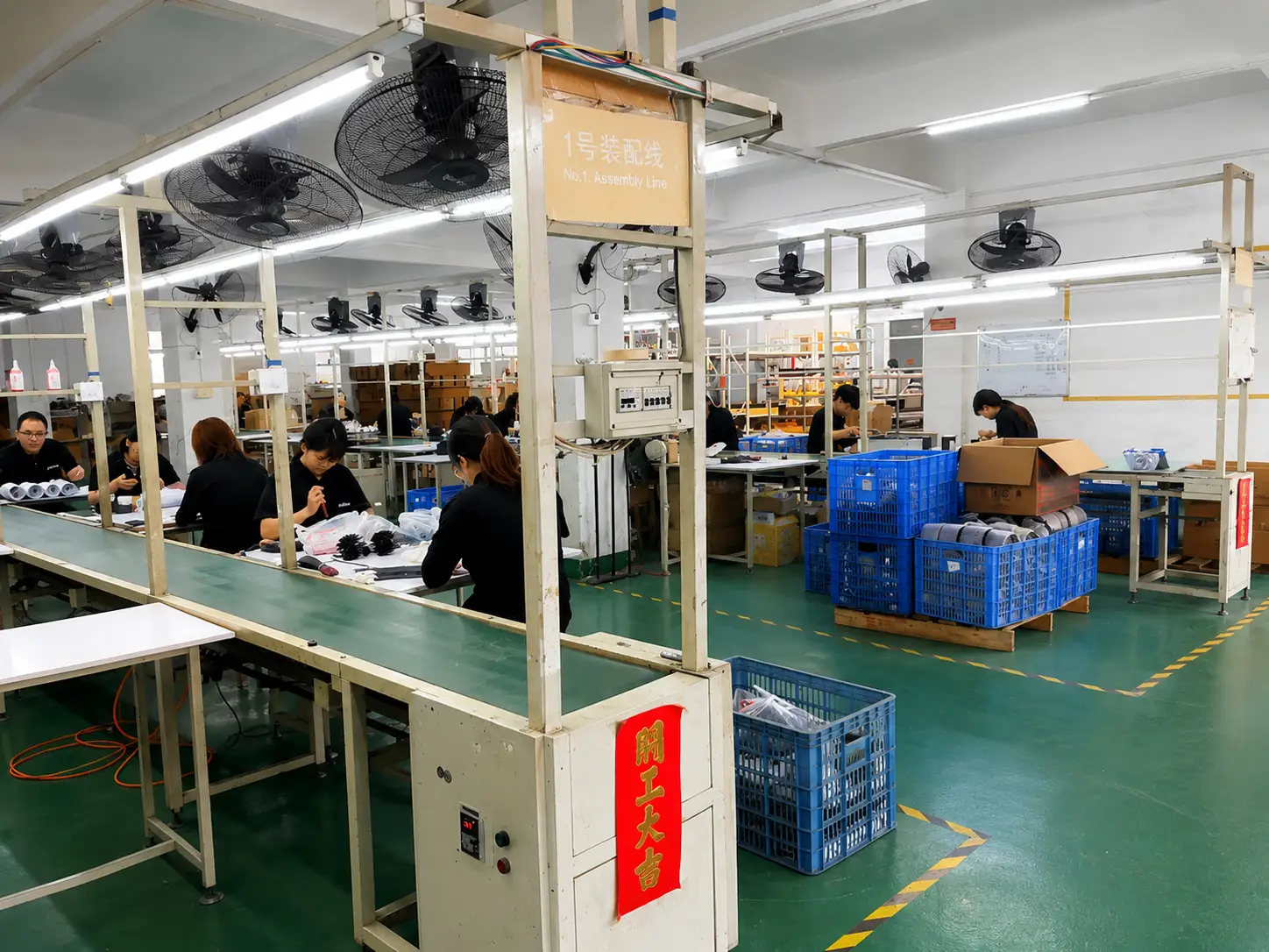 Architectural lighting assembly line with experienced production technicians at Artdon Lighting.