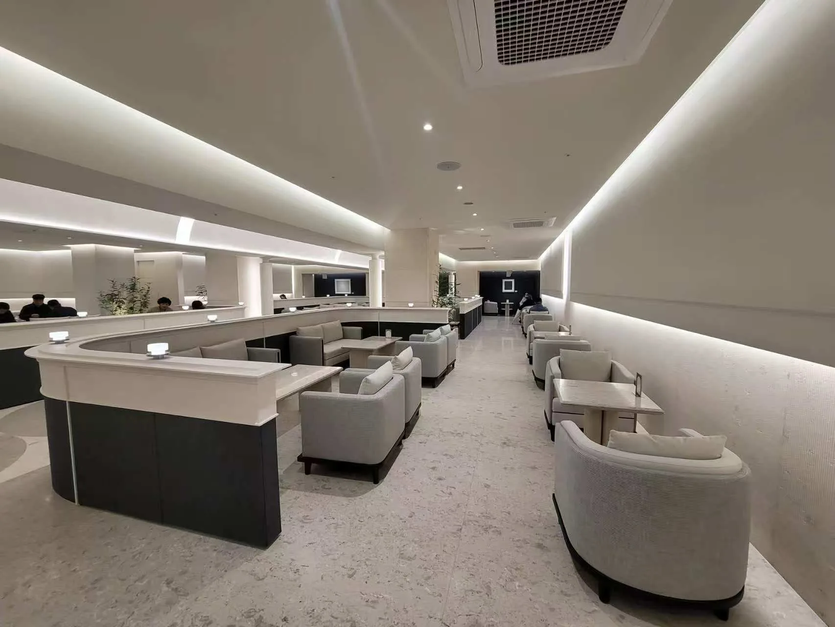 Linear Lighting installed in Korea Residential LED Strip Project in South Korea, showing residential lounge with continuous LED strip lighting along a curved ceiling.