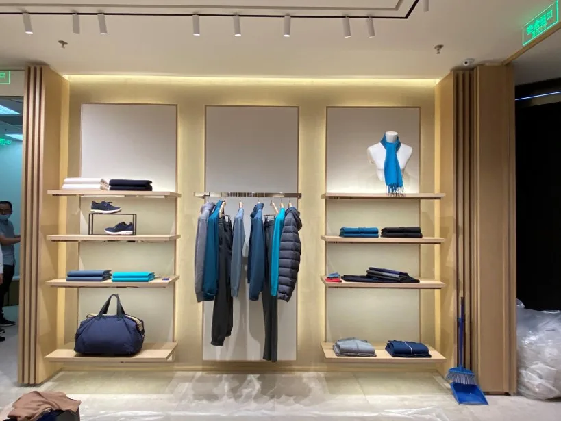 Cabinet Lighting installed in Loro Piana Boutique in an unidentified location, showing Loro Piana accessory wall with integrated shelf lighting.