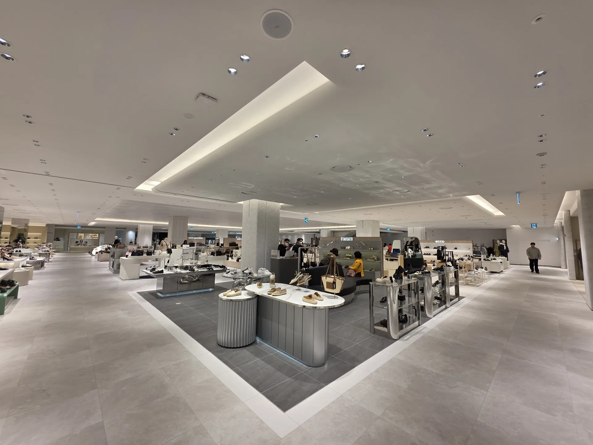 Footwear retail section featuring INTERO Recessed Downlights for balanced commercial lighting.