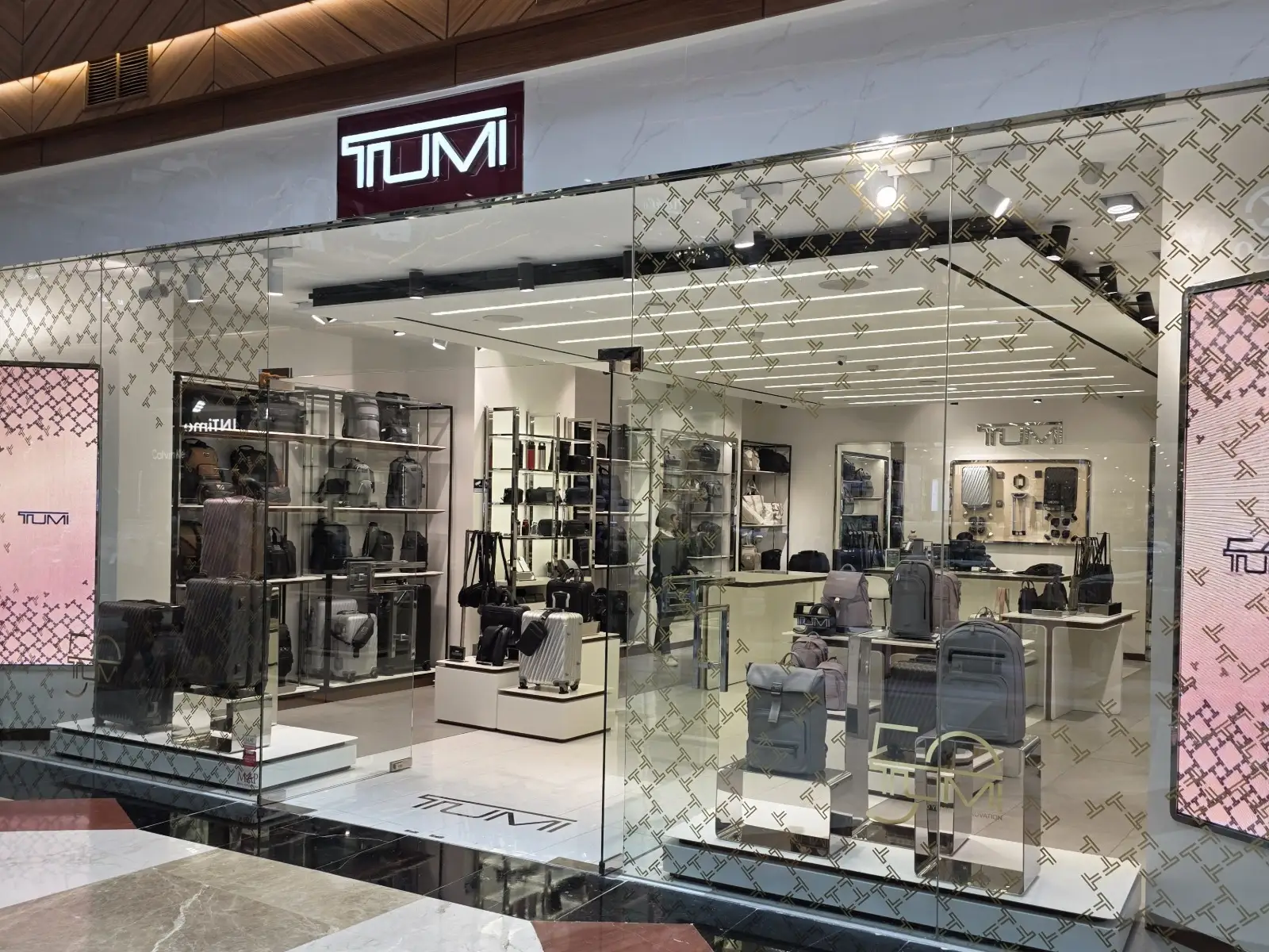 Track Lighting installed in TUMI Store Jakarta in Jakarta, Indonesia, showing TUMI store facade with ceiling track lighting in Jakarta.
