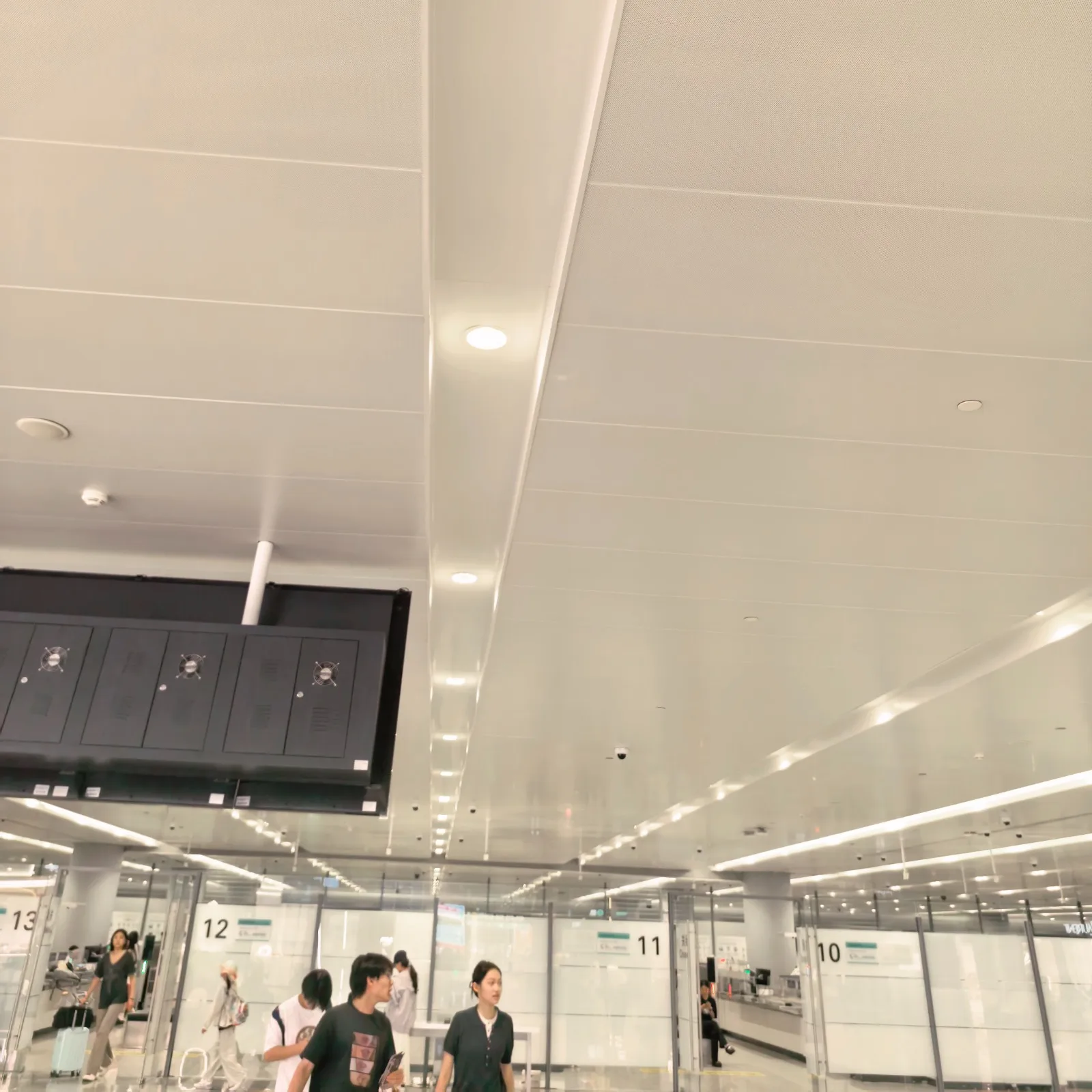 HICORE recessed downlights installed in a modern public service hall, providing comfortable architectural lighting for public facilities.