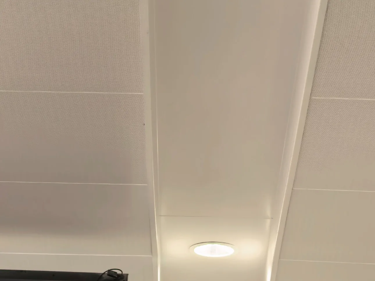 HICORE recessed downlight installed in a commercial office ceiling, providing clean architectural lighting for modern workspaces.