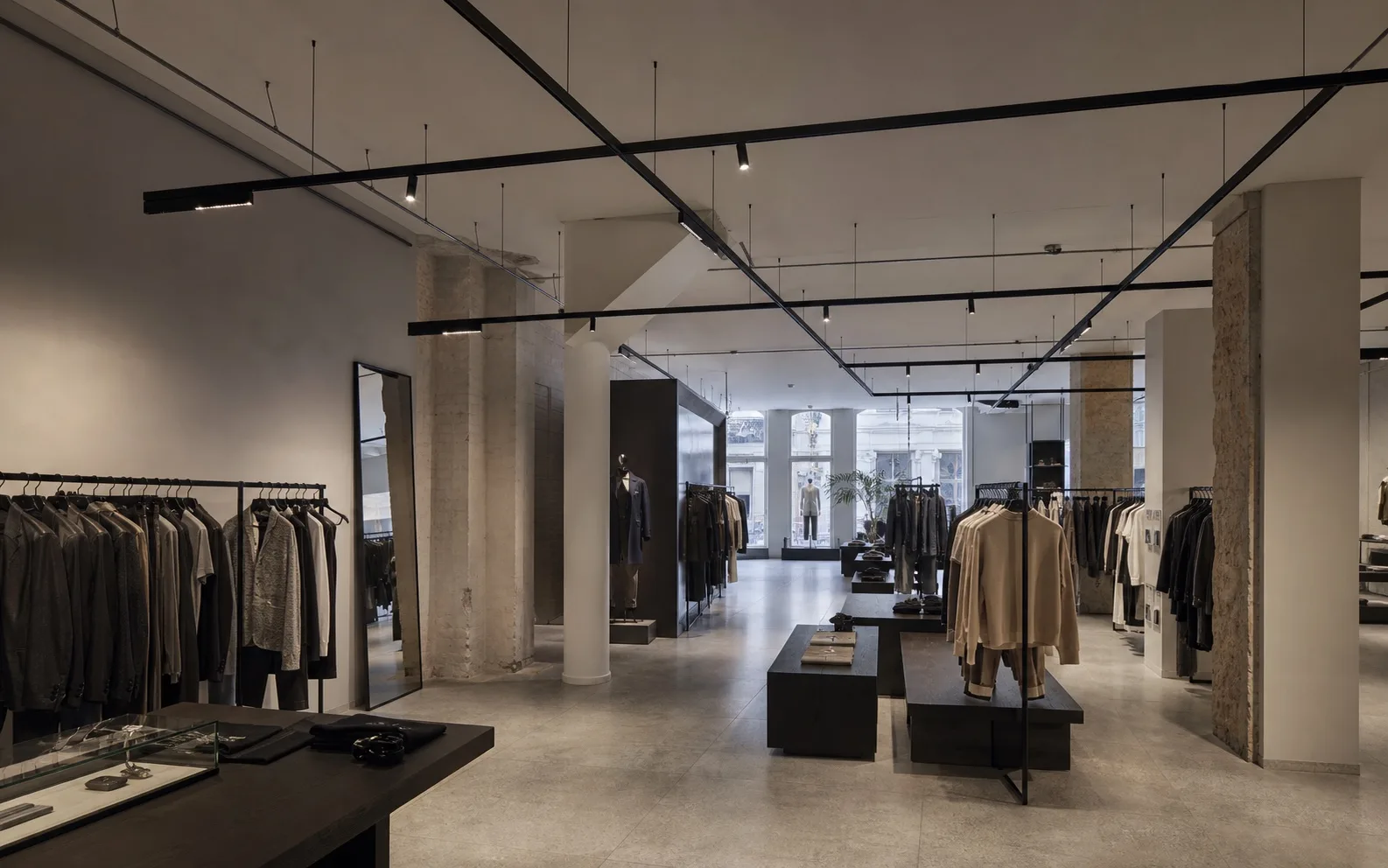 Suspended low-voltage magnetic track system in a Copenhagen fashion flagship store