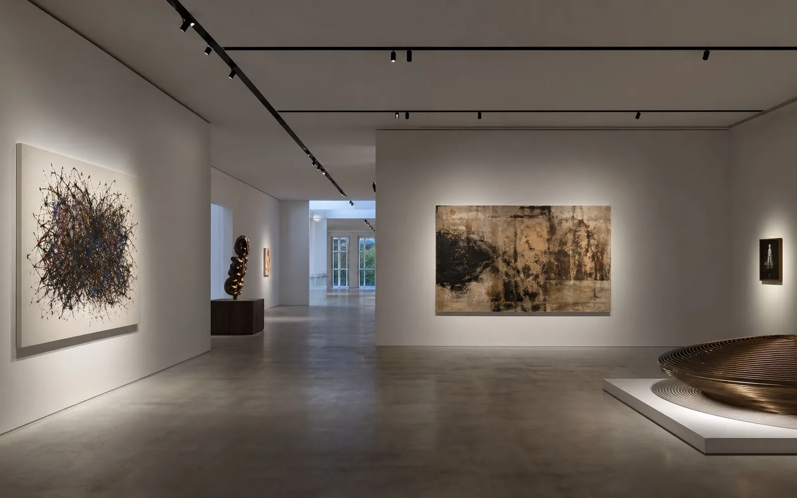 Deep recessed low-voltage magnetic track illuminating a Berlin contemporary art foundation