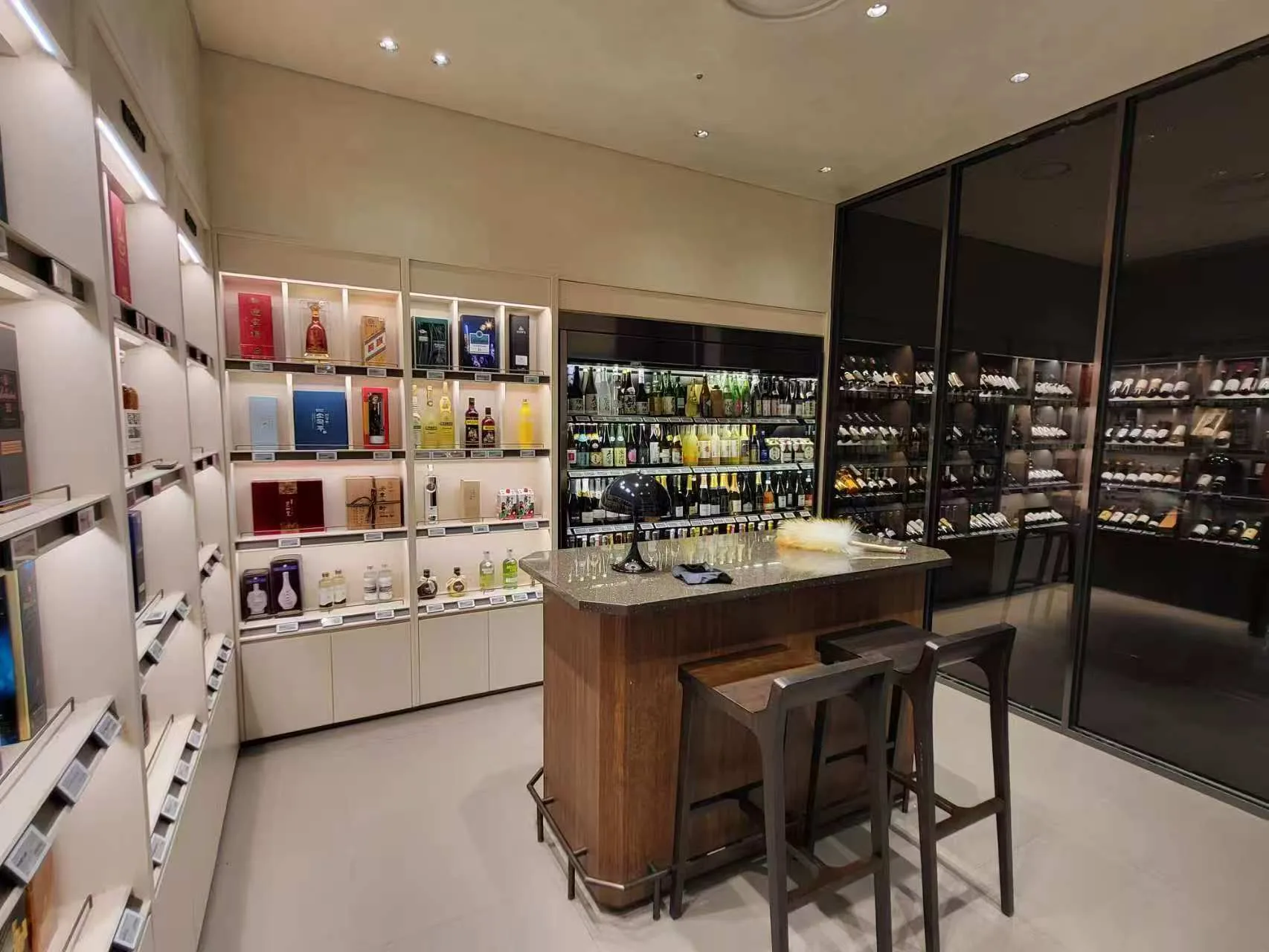 Premium wine and spirits display illuminated with SOFT Recessed Downlights and ULTRA-SLIM Cabinet Lights at Lotte Duty Free Singapore.